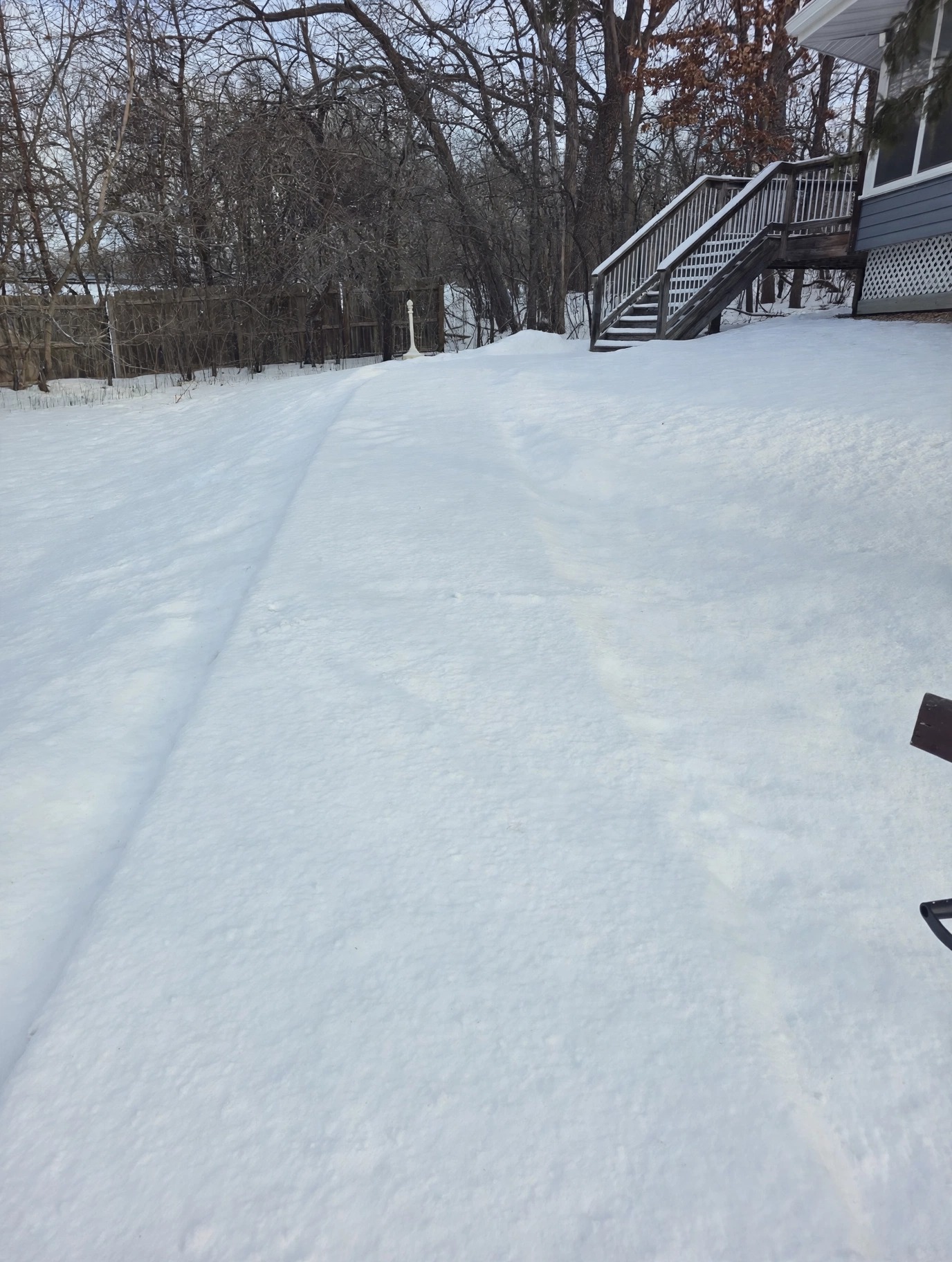 Walkway buried under snow before snow removal